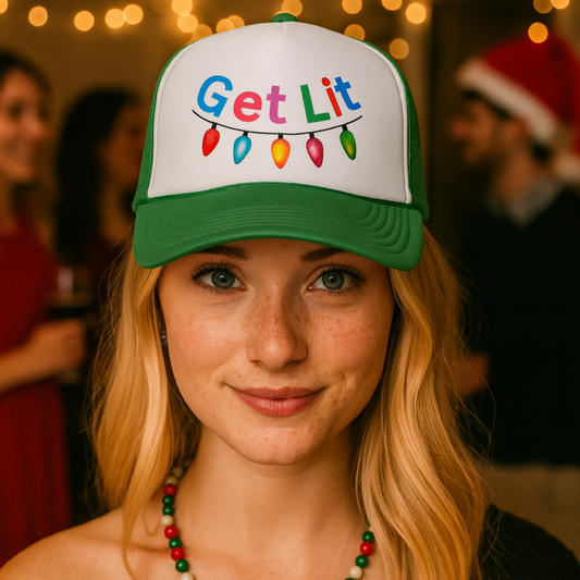 Person wearing a cap with 'Get Lit' text and Christmas lights design, surrounded by festive decorations.