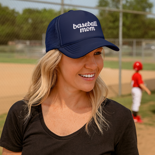 woman wearing navy trucker hat with baseball mom embroidered on the front