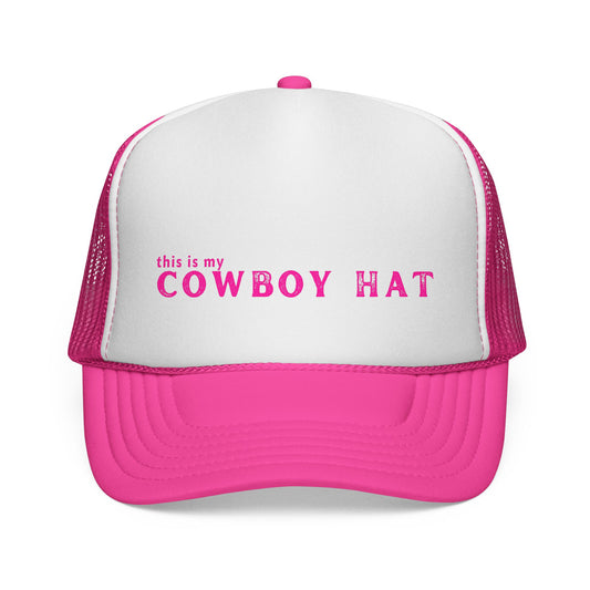 Pink and white trucker hat with 'this is my COWBOY HAT' text on a white background
