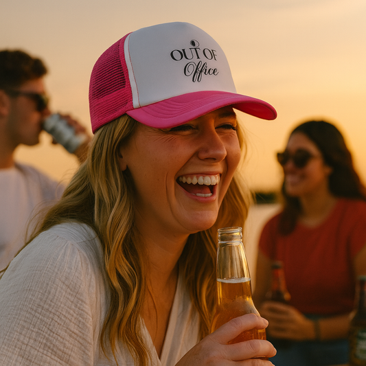 out of office trucker hat on female in pink and white