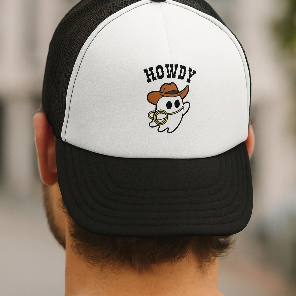 Person wearing a black and white cap with 'HOWDY' and ghost design.